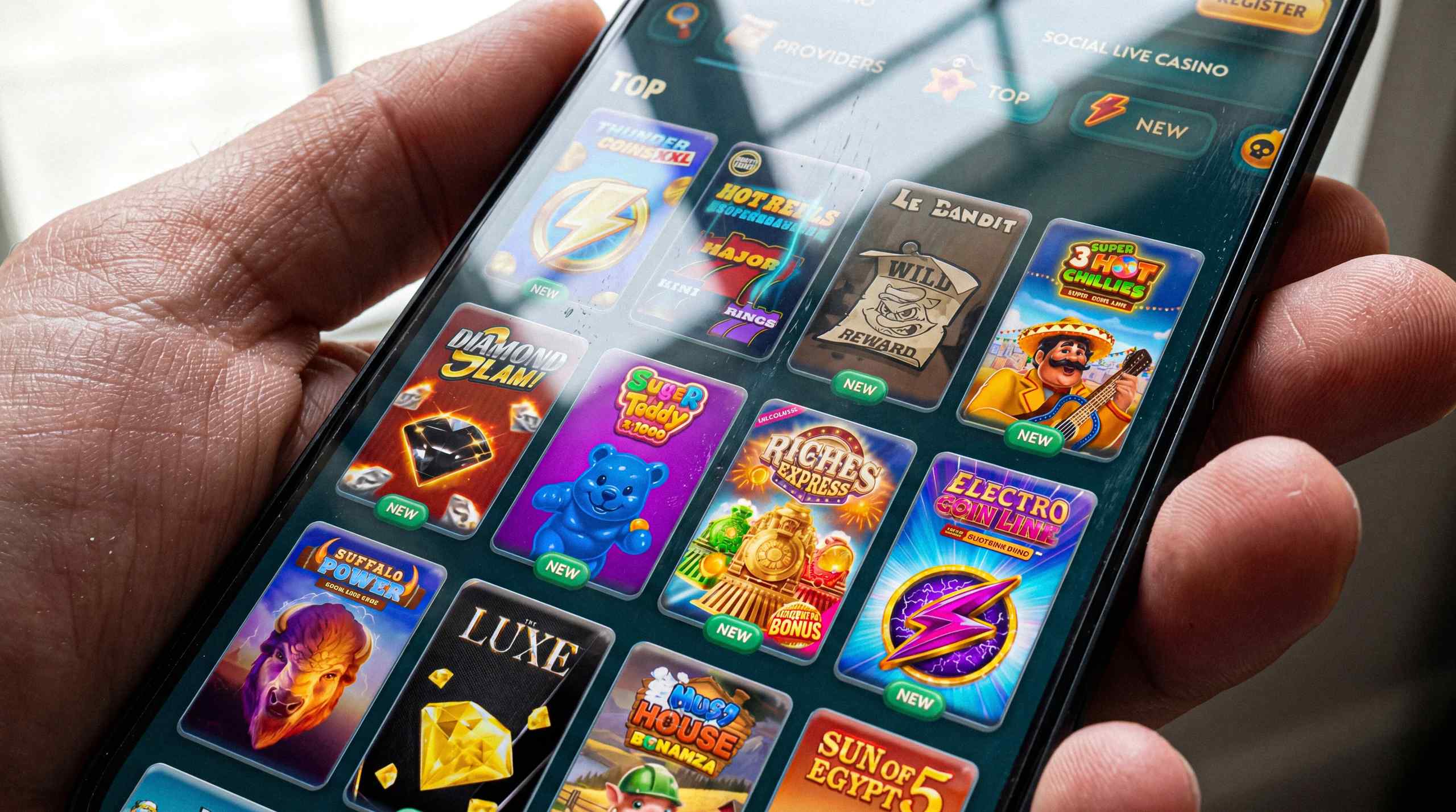 A smartphone with a number of different sweepstakes games displayed on the screen.